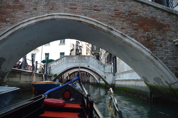 Walk In Gondola Passing Under The Bridges Of The Canals In Venice. Travel, holidays, architecture. March 29, 2015. Venice, Veneto region, Italy.