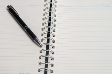Notebook with black pen, Colorful notepads on the desk, Glasses on the desk with pen and cup of coffee, Computer keyboard with colorful note stick