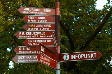 Tourist signs (in Estonian and in English) to attractions  and information point at the Town Hall Square in Tartu, Estonia