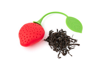 Silicone strainer in the form of strawberries for tea isolated on white background. 