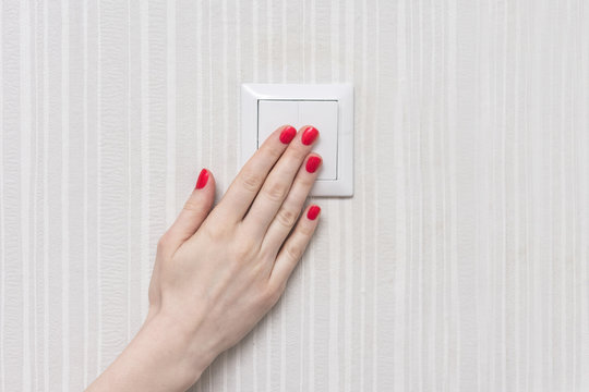 girl presses the switch, front view, copy space, background