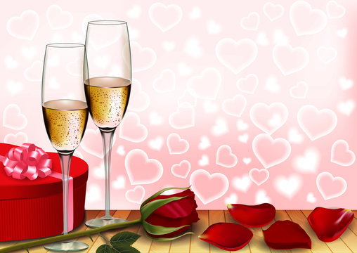 glasses of wine with a rose and a gift box on Valentine's Day