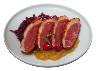 Obraz premium Fried duck breast Magre served with boiled cabbage and caramelized onions