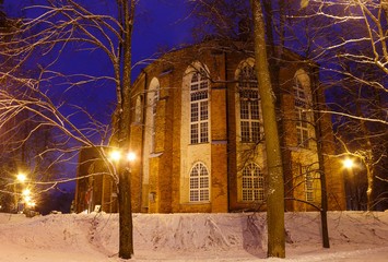 Tartu Cathedral (Estonian: Tartu toomkirik, the restored part which is University museum now) in the park on the hill of Toomemagi on a winter snowy evening. Tartu, Estonia
