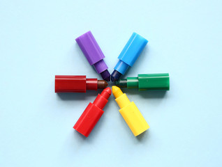Multicolored short wax crayons. Children's creativity and hobby. Rainbow symbol.