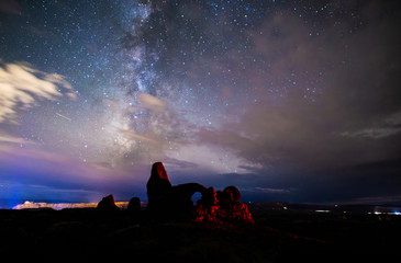 Milky Way breaking through clouds over Turret Arch, Arches National Park © Arthur Cauty