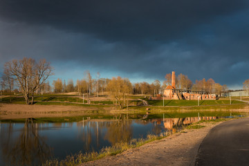 Fototapeta premium Raadi manor park next to Estonian National museum and the view on the Raadi lake during spring, Estonia, Tartu