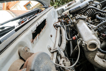 A detail picture of an old wreck. The VIN code is cut away. 