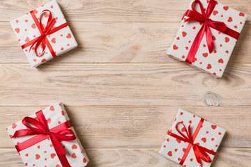 Frame of many Colorful gift boxes with red bow and heart blank copy space top view, Valentine or other holidays celebrations concept