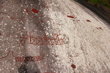 A prehistorical drawing in Sweden. Painting shows the sledges and people. 