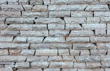 Pattern of the light modern stone brick wall or rough textured background