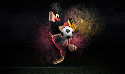 Football player in action on a dark