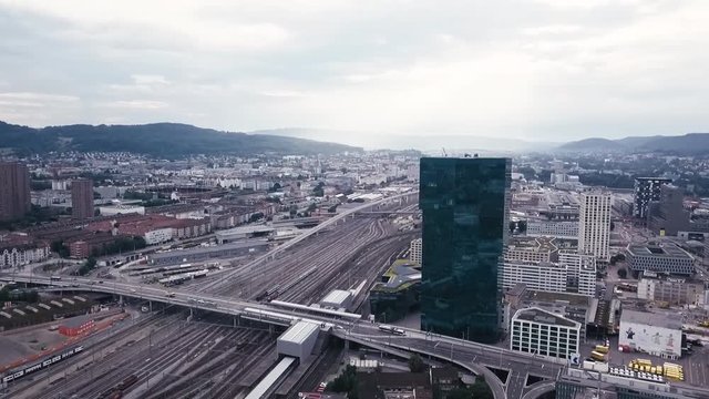 aerial city view around skyscraper and train track