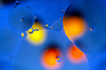 colored shapes with yellow and orange spots on blue background