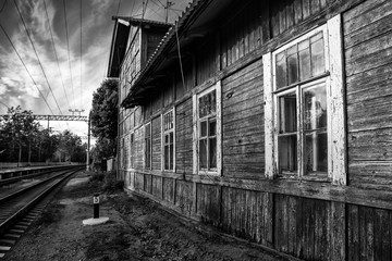 Fototapeta na wymiar old wooden building at railway station, black and white