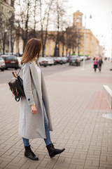 A young woman walking on the street