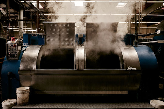Steam emitting from washing machine in factory