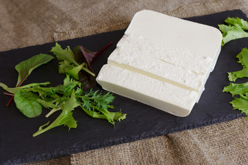 Bryndza cheese on rustic background. Serbian cuisine.