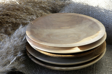 Stack of wooden plates Kitchen decor Brown tones