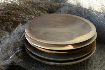 Stack of wooden plates Kitchen decor Brown tones