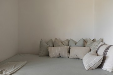 Pillows arranged on a bed in bedroom