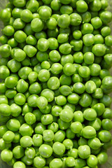Green peas on a wooden  background