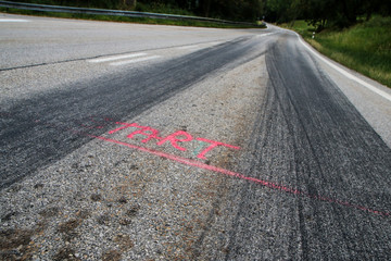 The rubber tracks from the racing cars left on the tarmac at the start of the hill climb stage. 