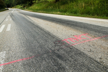 Obraz premium The rubber tracks from the racing cars left on the tarmac at the start of the hill climb stage. 