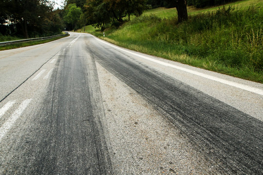 The rubber tracks from the racing cars left on the tarmac at the start of the hill climb stage. 