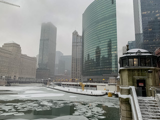 Foggy, snowstorm, frozen river winter weater in Chicago