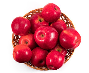 basket with red apples on white background