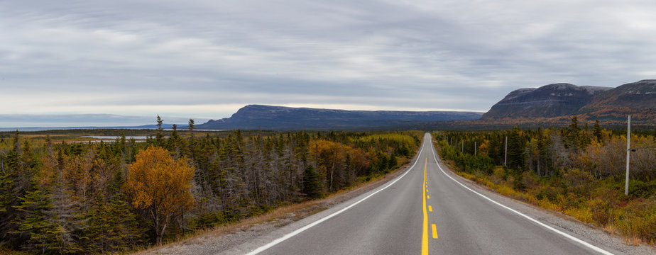 Beautiful view of a scenic road during a cloudy day. Taken in Northern Newfoundland, Canada.