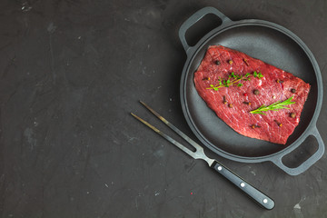 Fresh raw meat beef steak with ingredients for cooking spices