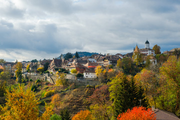 A beautiful view of the historical Aubonne village, Switzerland in a fantastic colorful autumn landscape.