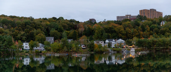 Armdale, Halifax, Nova Scotia, Canada - October 7, 2018: Residential homes by the water during a cloudy sunrise. © edb3_16