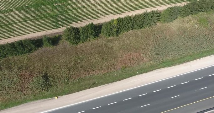 Aerial Crossing Highway Into Farmland Footage over White Truck