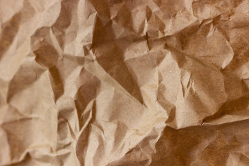 Brown wrinkle recycle paper background. Texture of crumpled paper. Texture of rumpled old paper close-up.