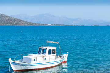 Fototapeta na wymiar fishing boat at the pier in Crete