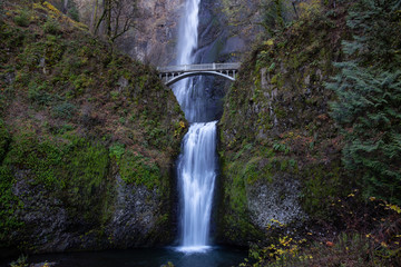Beautiful view of a bridge going over a river with Multnomah Falls in the background. Located near Portland, Oregon, United States.