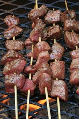Beef kebabs cooking on the grill