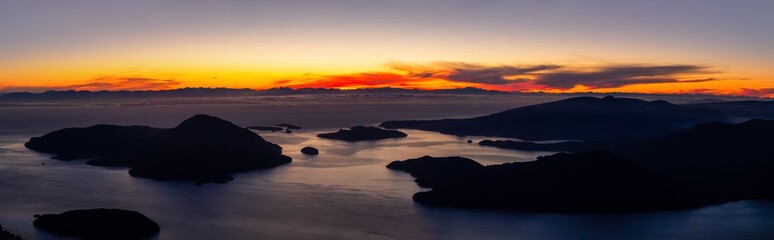Beautiful Panoramic Canadian Landscape view during a colorful winter sunset. Taken from top of Mnt Harvey, North of Vancouver, BC, Canada.