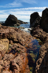 Rocky beach on the Pacific Ocean Coast during a sunny summer day. Taken in Palmerston Beach, Northern Vancouver Island, BC, Canada.