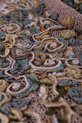 Crochet knitting. Lace of flowers.  Handmade Irish lace as a background