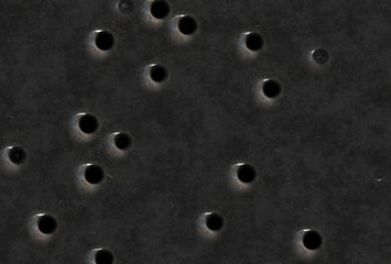 bullet holes in steel background