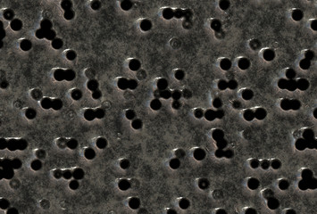 bullet holes in steel metal plate