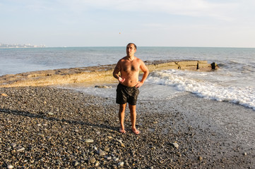 A man stands on the beach