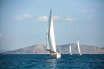 Sailing boats in the regatta, luxury yachting in Aegean Sea, Greece.