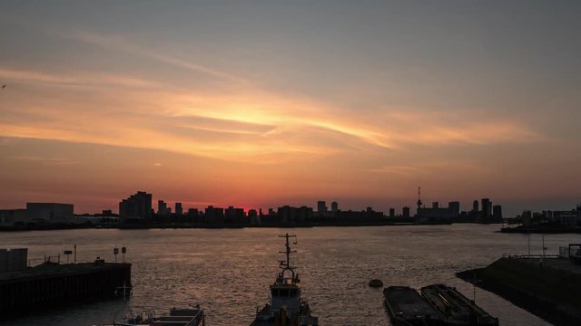 Colorful timelapse of sunrise over city of Rotterdam