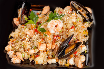 Japanese national popular cuisine. Sushi, rice and fish. Tasty, beautifully served food in a restaurant, cafe, with elements of the original design.