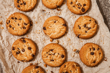 Chocolate chip cookies on wooden background. Sweet biscuits. Homemade pastry